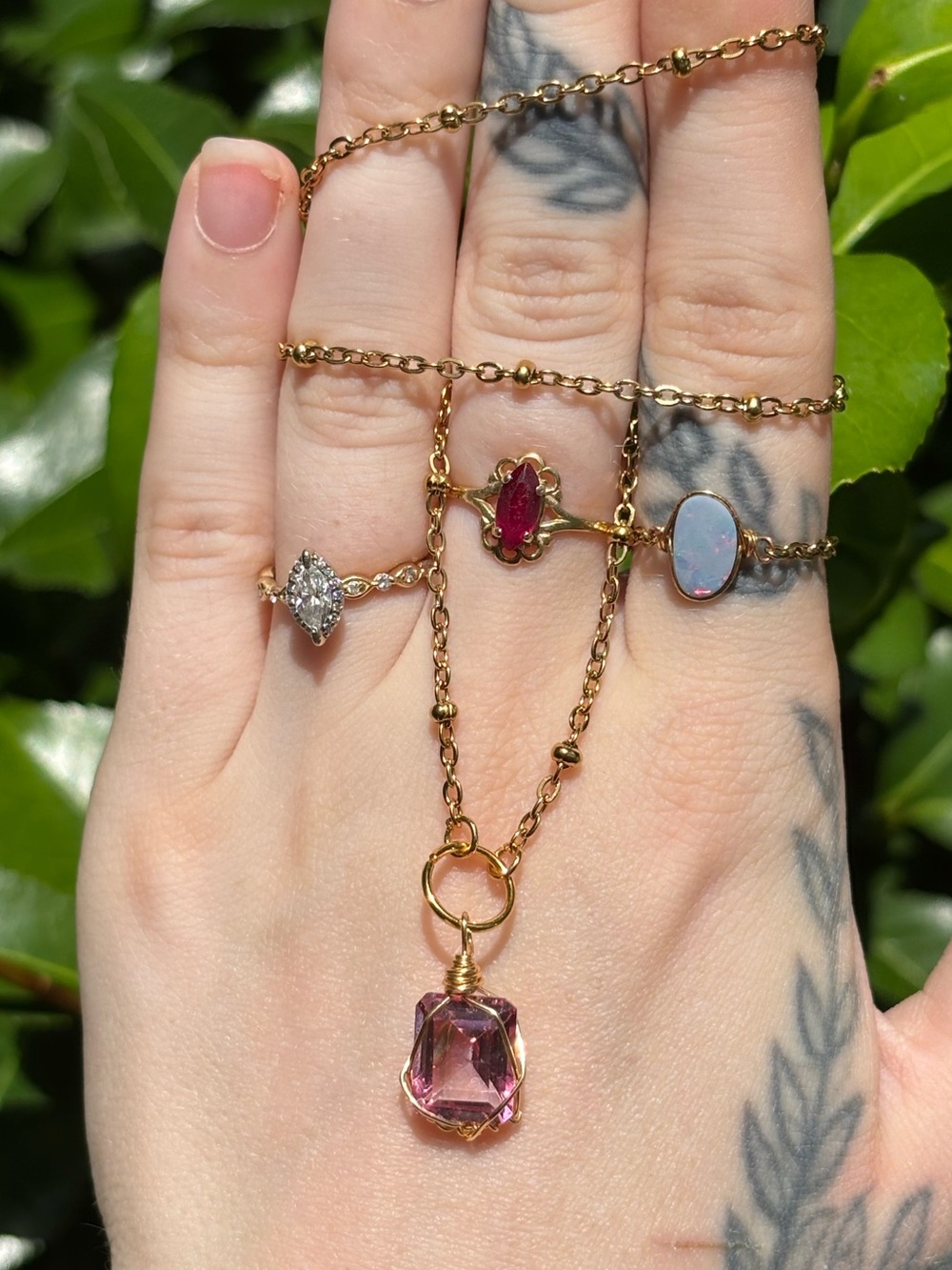Pink topaz charm necklace